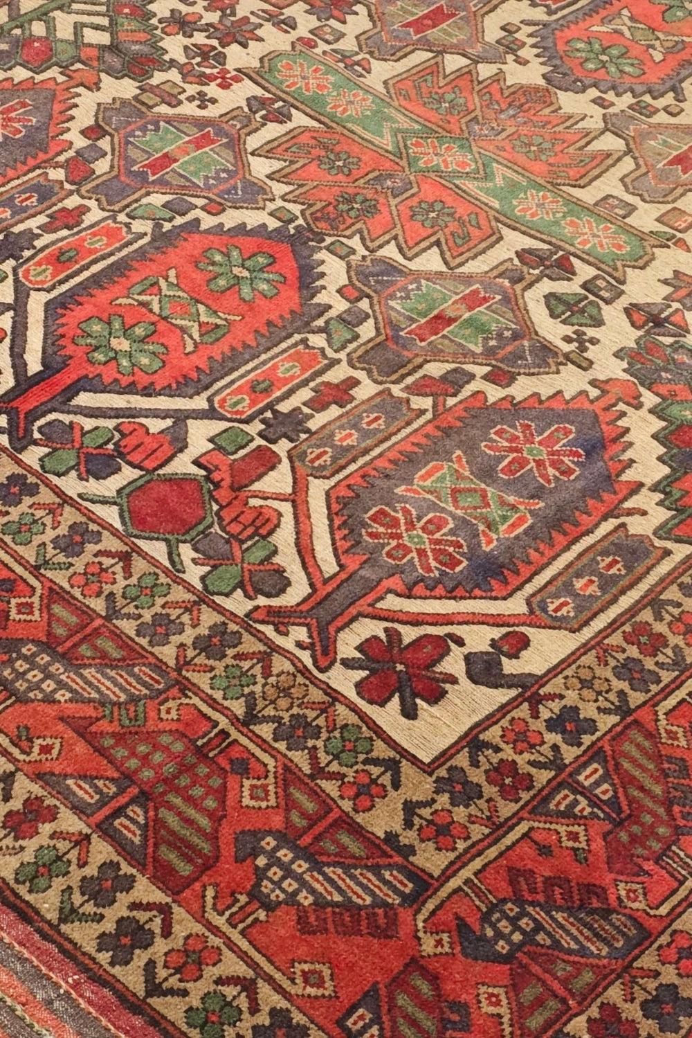 Laspanji pattern detail in cream and orange on Afghan kilim