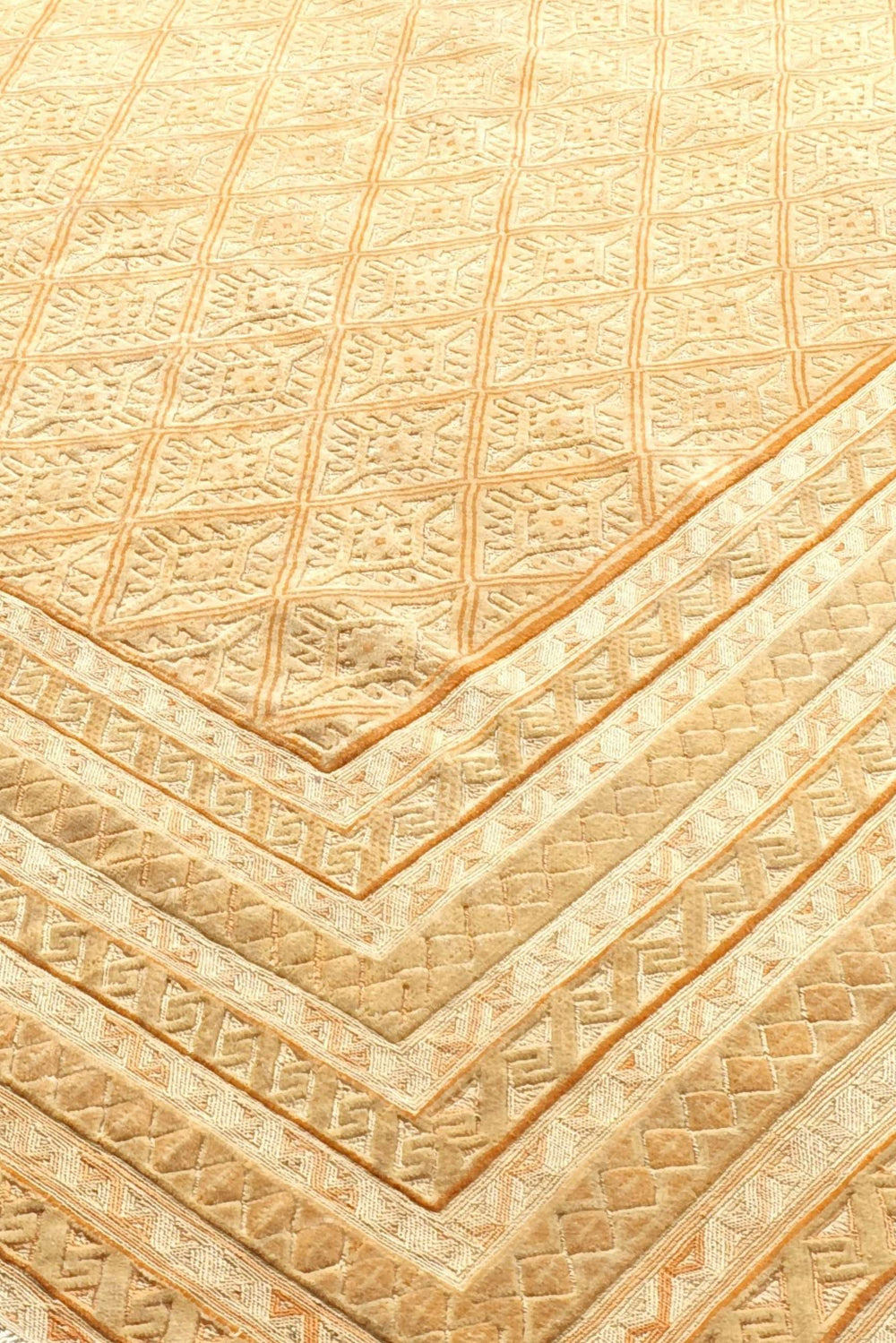 Diamond lattice detail in pale gold and cream on Afghan kilim