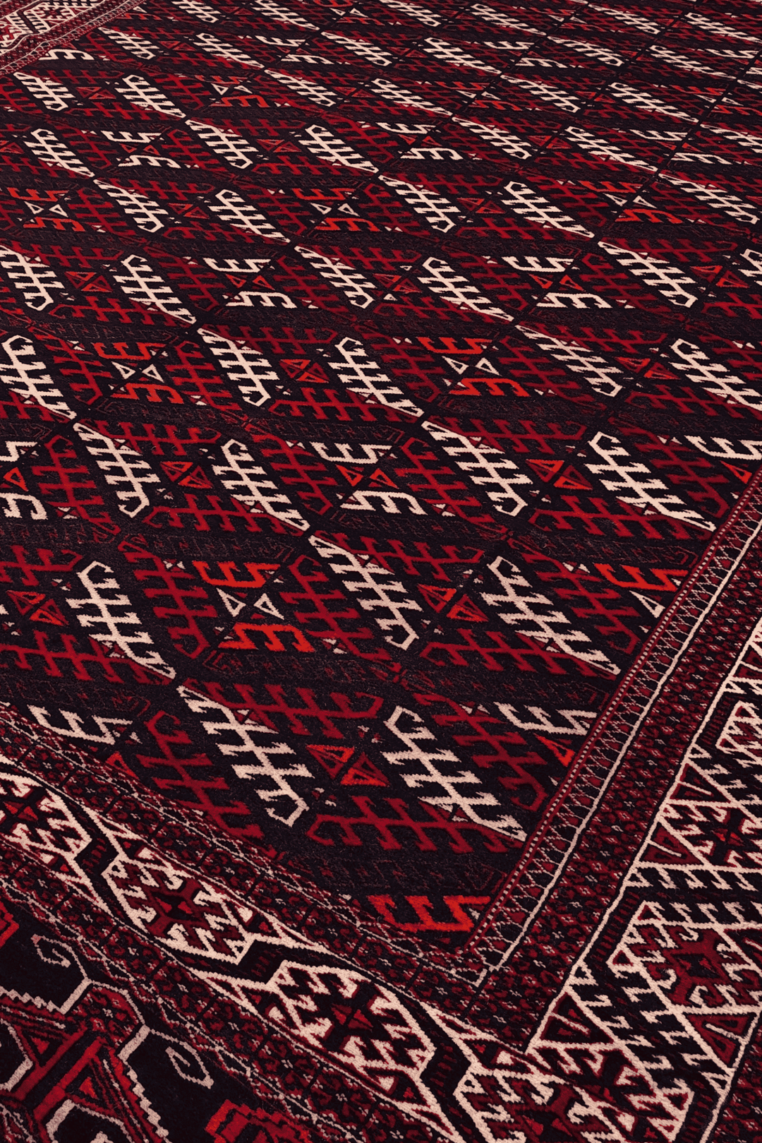 Turkmen panel design in aubergine and ivory on Afghan wool rug