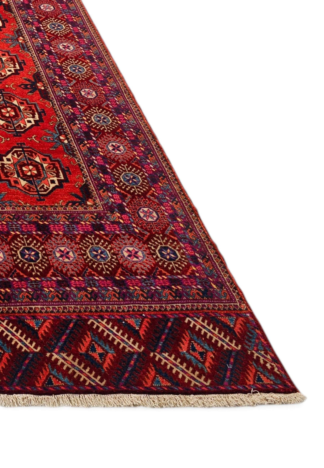 Corner of brick red Turkmen gül Afghan Sherwan rug