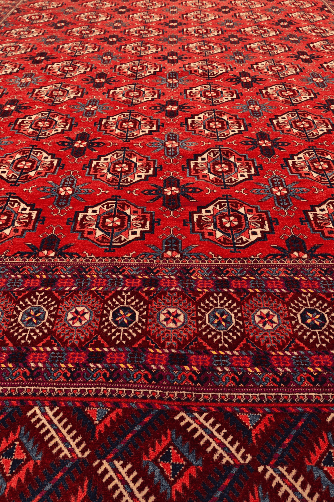 Fringe of brick red Afghan Sherwan hand-knotted wool rug