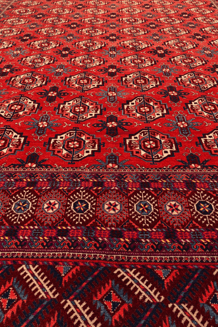Fringe of brick red Afghan Sherwan hand-knotted wool rug