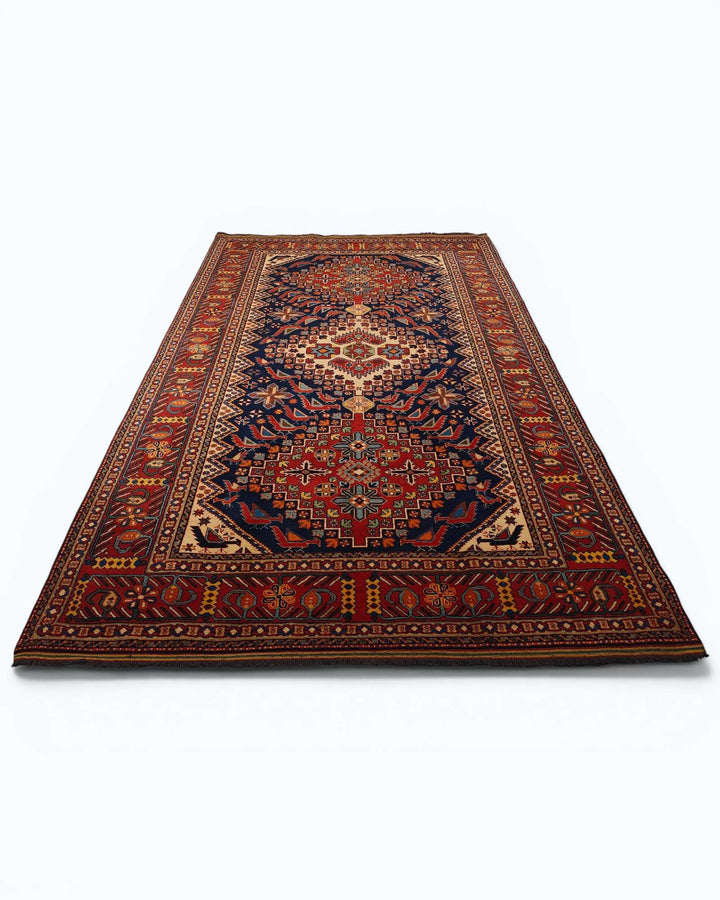 Hand-knotted wool pile of indigo Caucasian Afghan rug