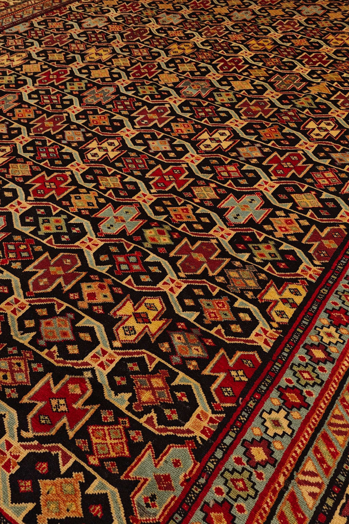Hand-knotted wool pile of red Chi-Chi Afghan Sherwan rug