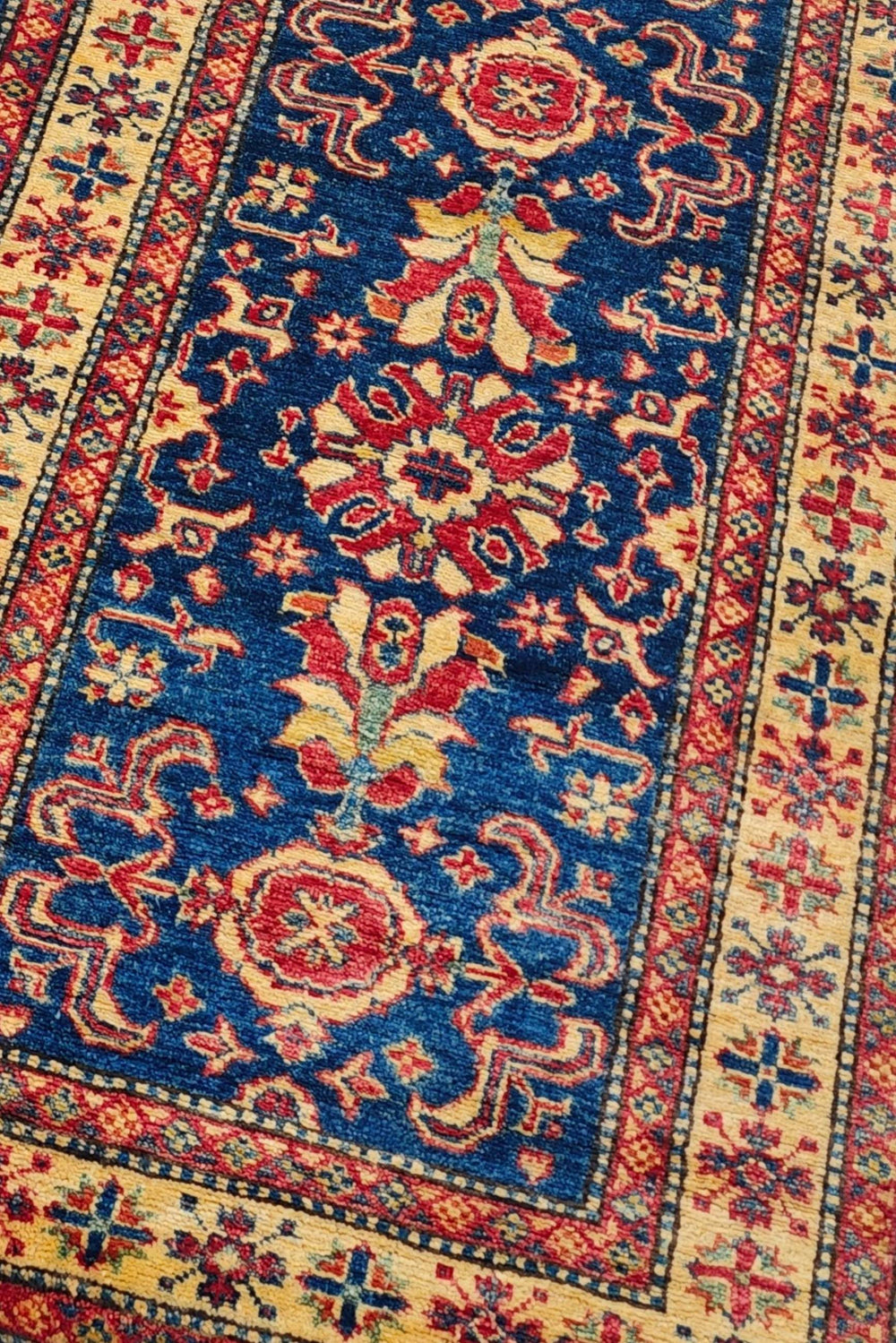 All-over floral design in navy and gold on Afghan Sherwan runner