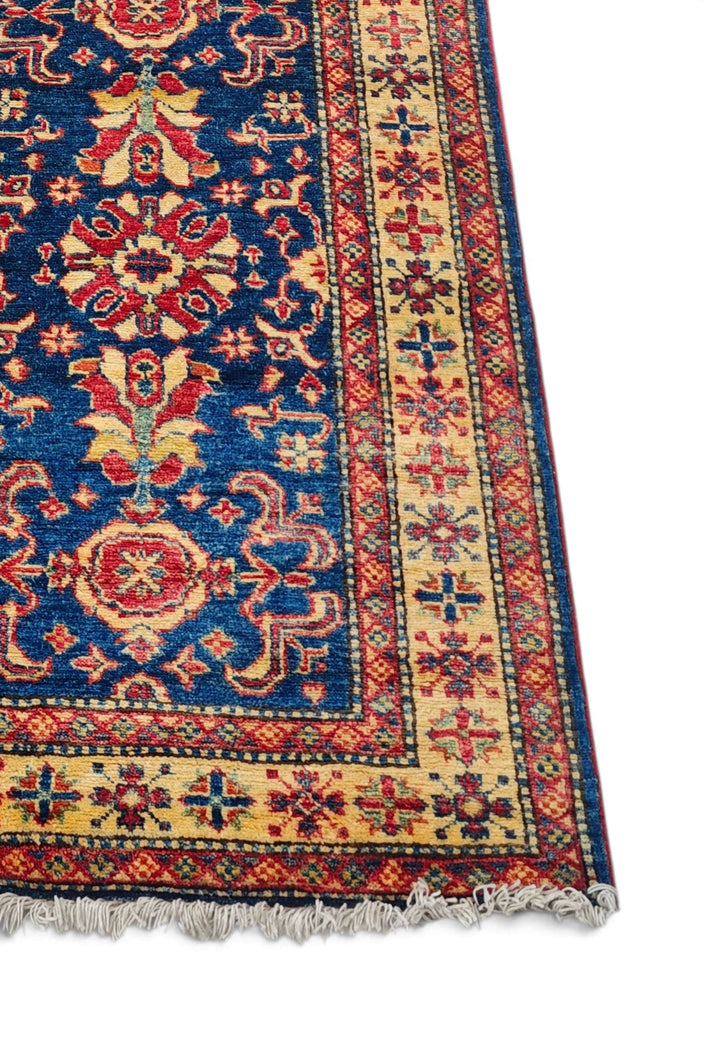 Corner of navy gold all-over floral Afghan hand-knotted runner