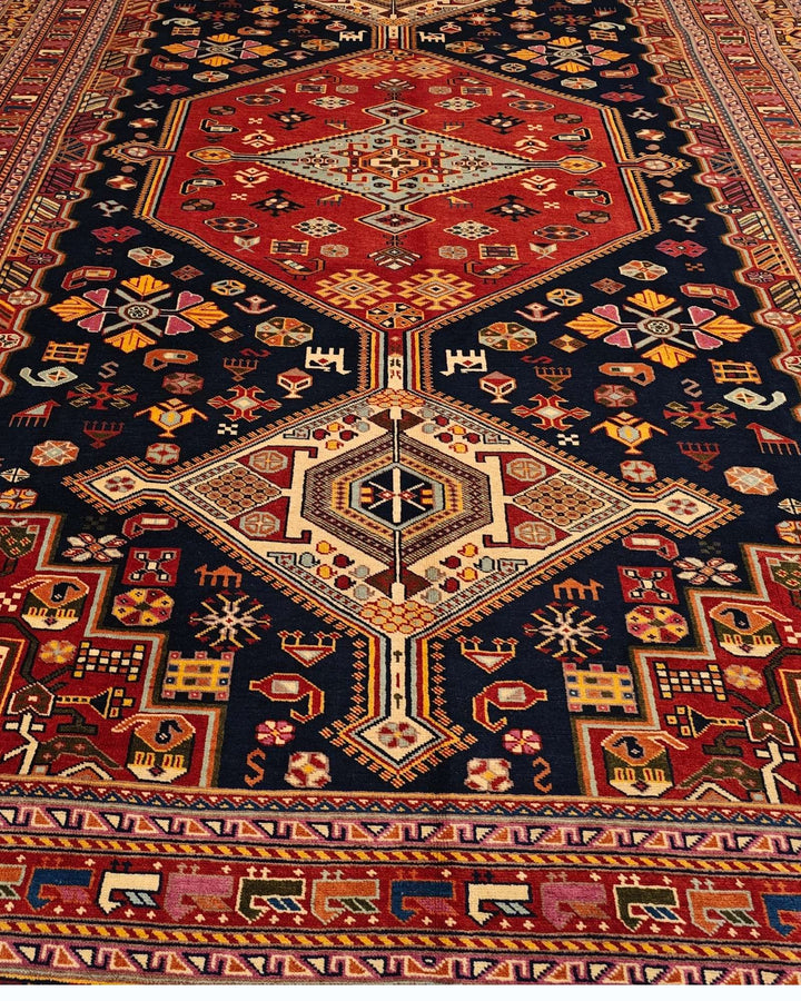 Hand-knotted wool pile of navy Khamseh Afghan Sherwan rug