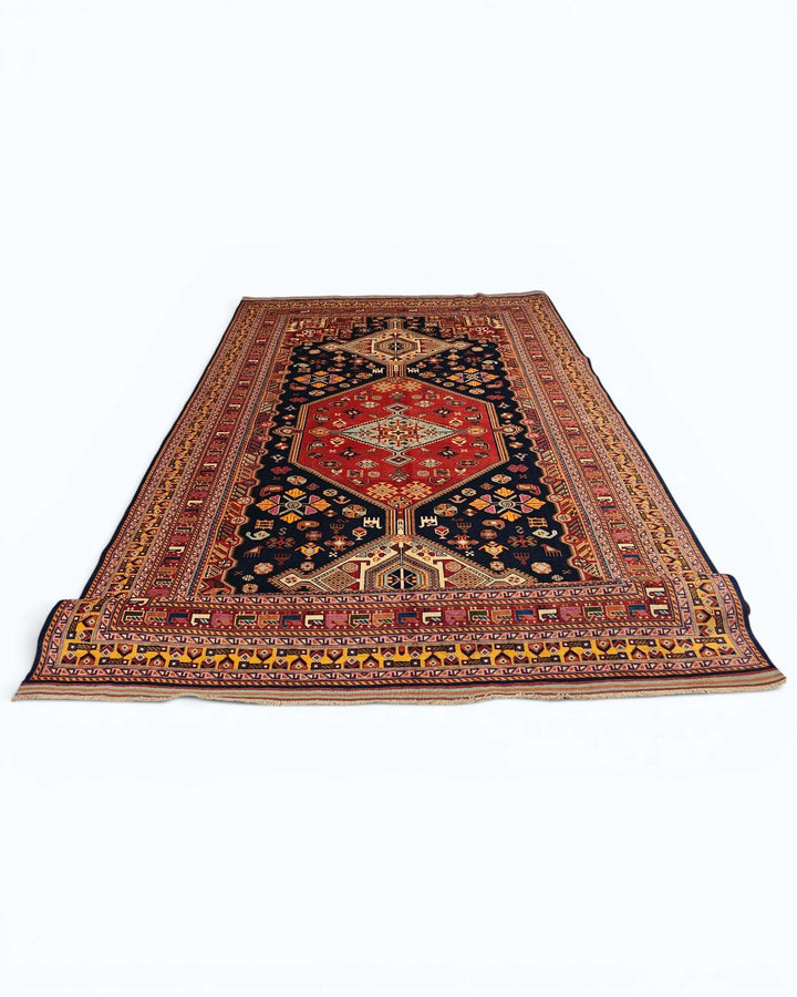 Corner of navy and red Khamseh Afghan hand-knotted rug