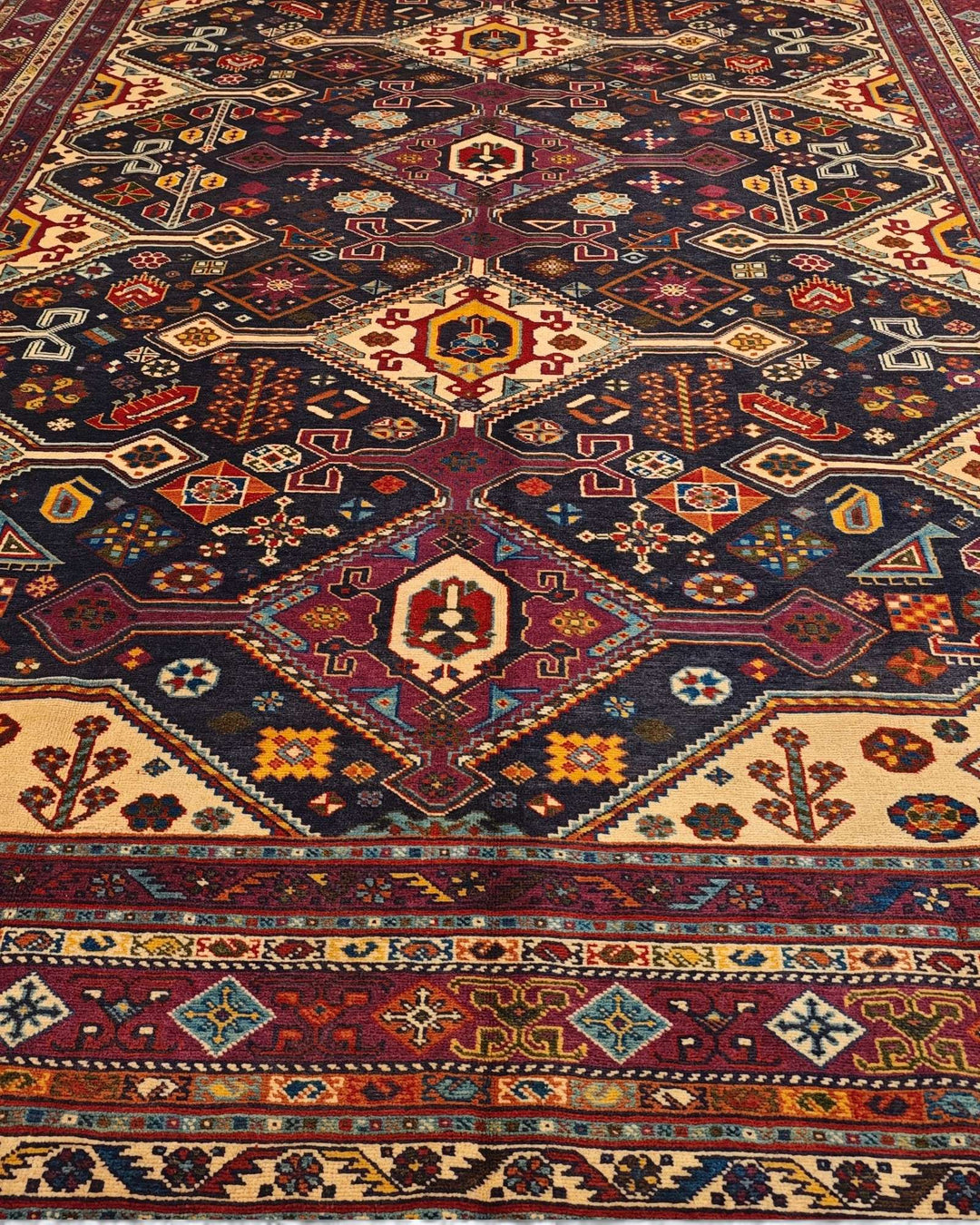Border detail of navy and red Shahsavan hand-knotted Afghan rug