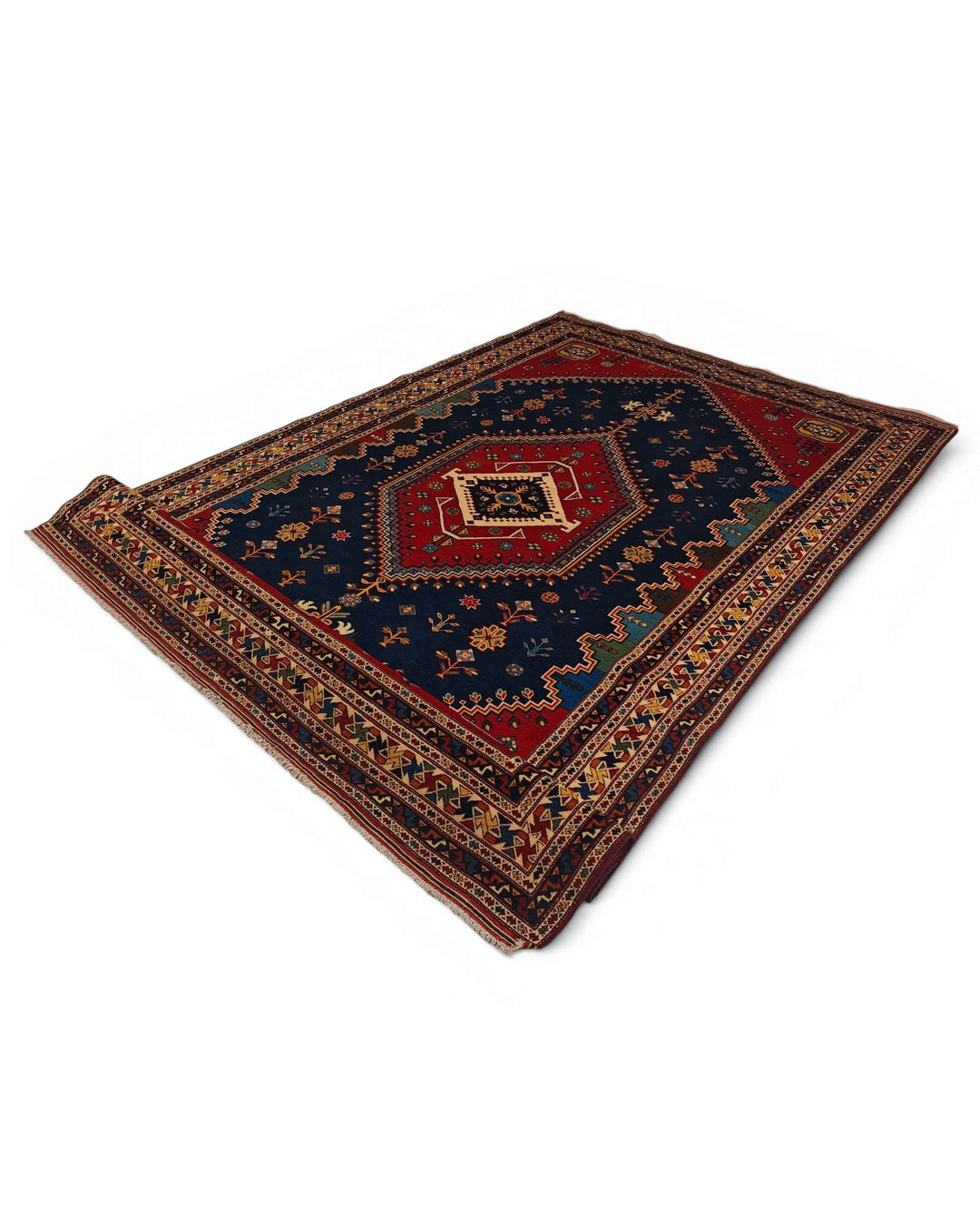Fringe of navy and red Afshar Afghan Sherwan rug