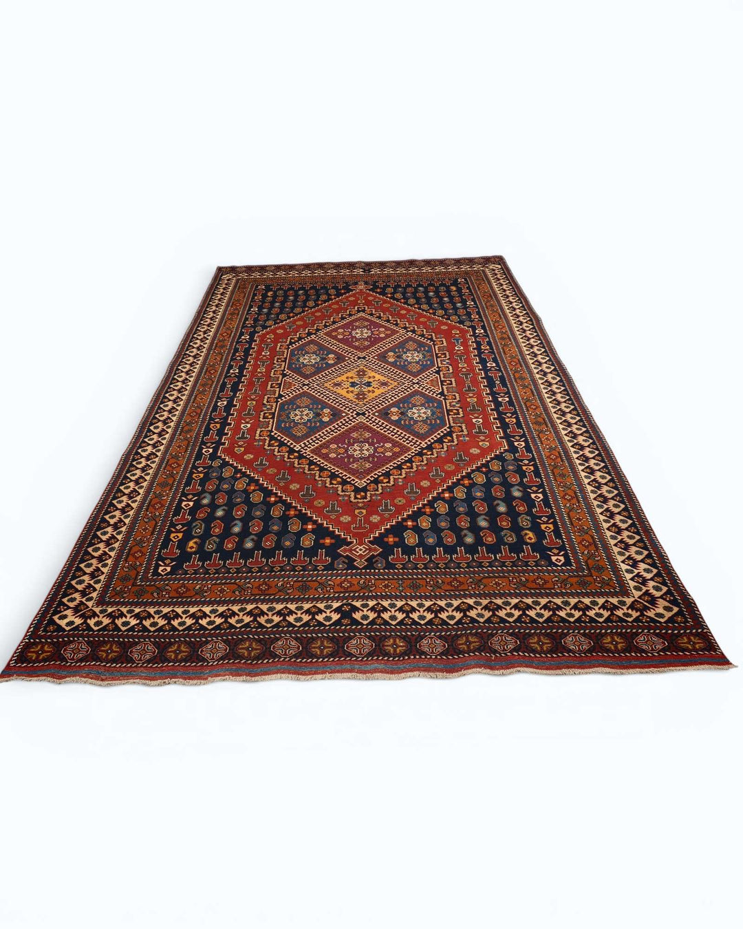 Tribal medallion rug in navy and red, hand-knotted Afghan wool