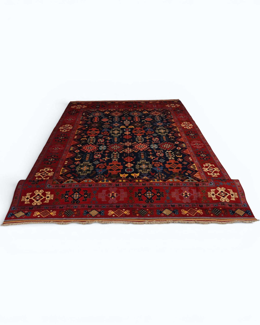Corner of navy and red Afshan Afghan hand-knotted rug