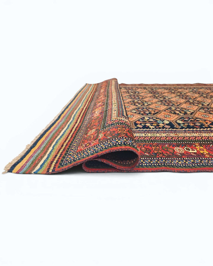 Hand-knotted navy Afghan rug with garden lattice field