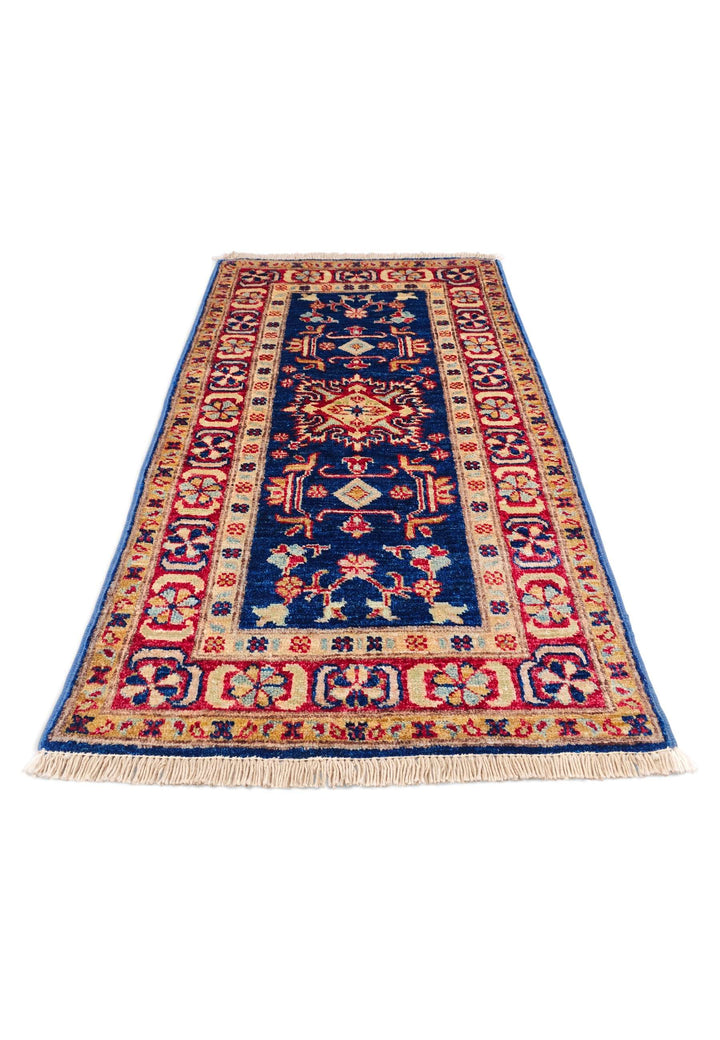 Border detail of navy and red hand-knotted Sherwan rug