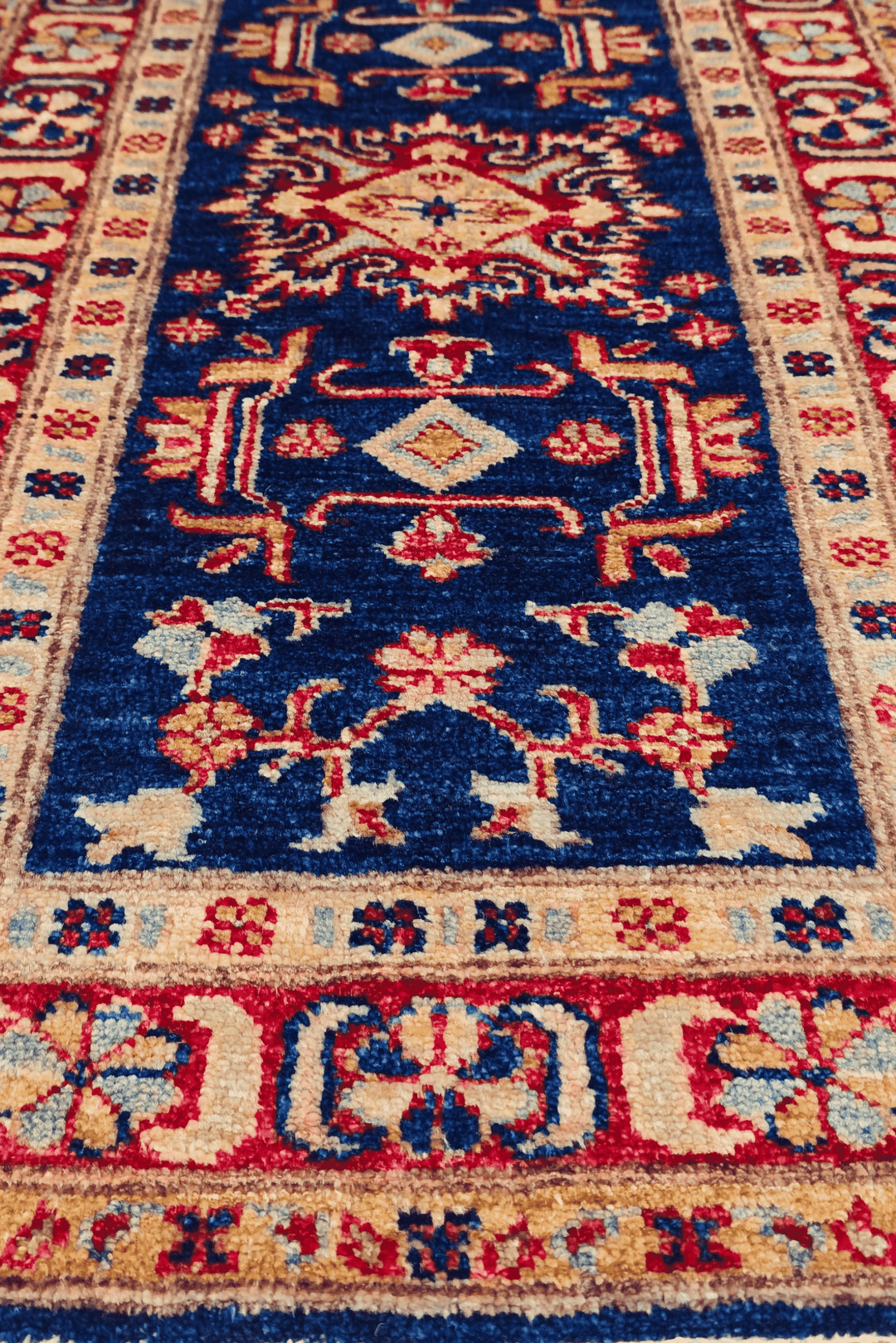 Navy and red Caucasian medallion rug for an entrance, 52×98cm