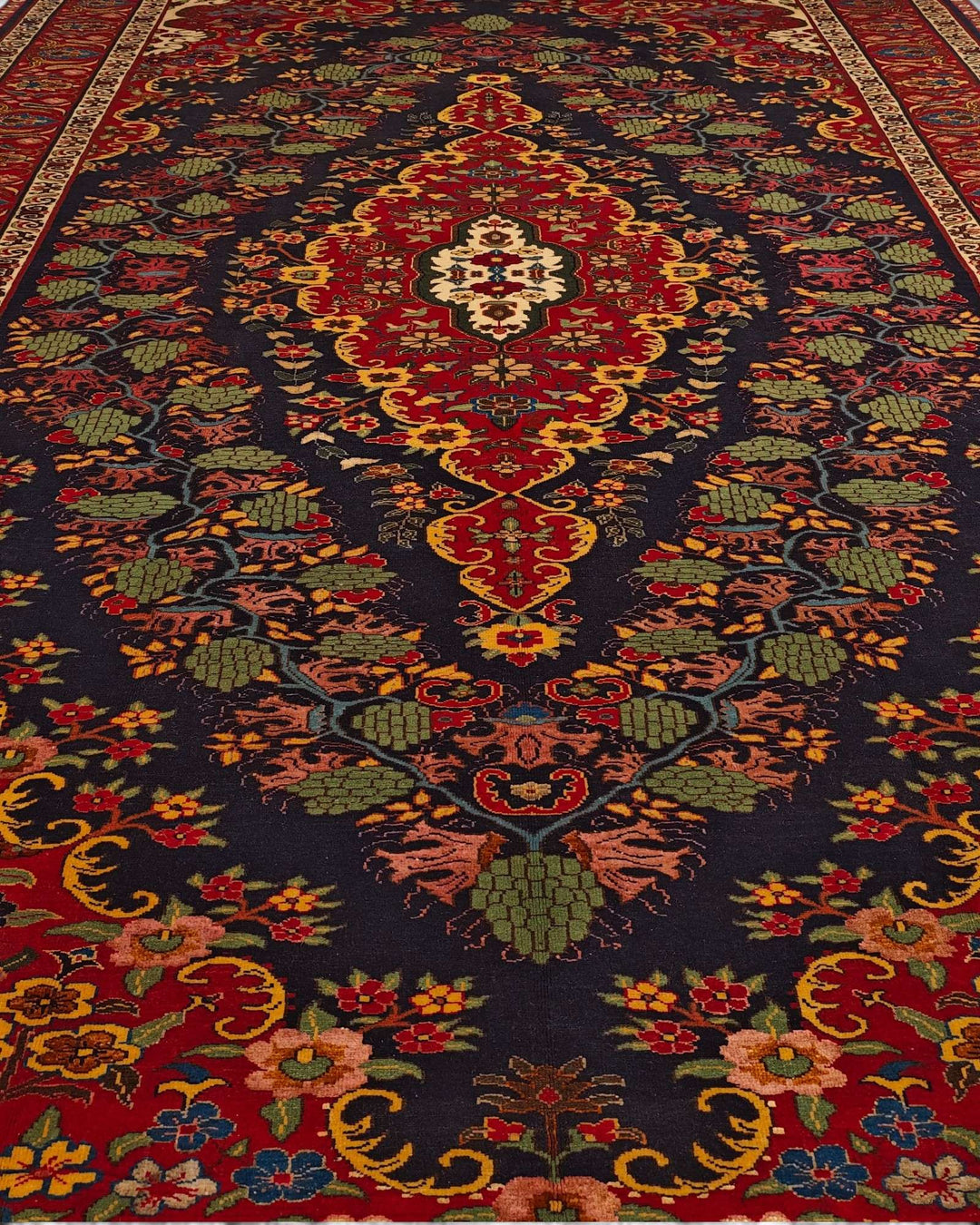 Border detail of navy and red Kashan hand-knotted Afghan rug