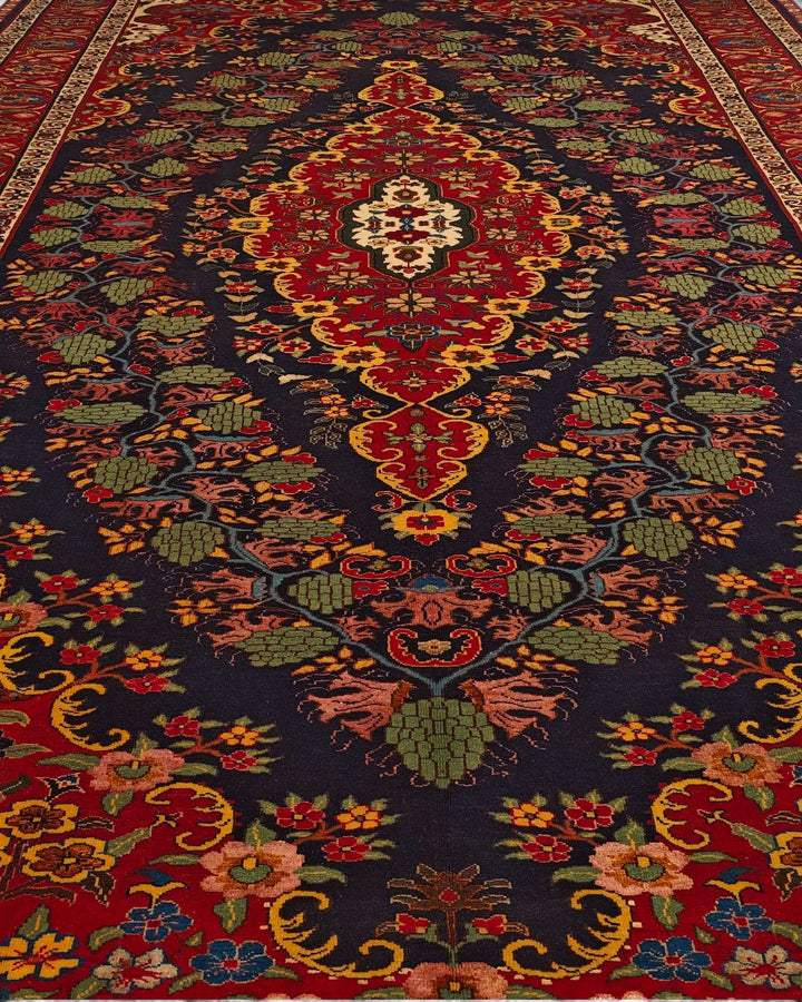 Border detail of navy and red Kashan hand-knotted Afghan rug