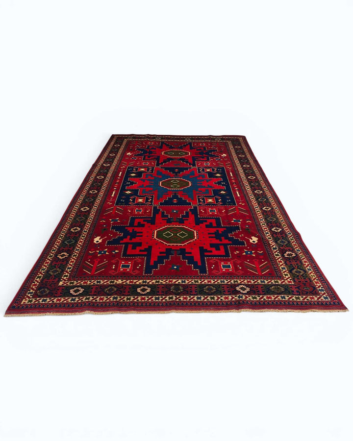 Hand-knotted wool pile of red Lesghi star Afghan rug