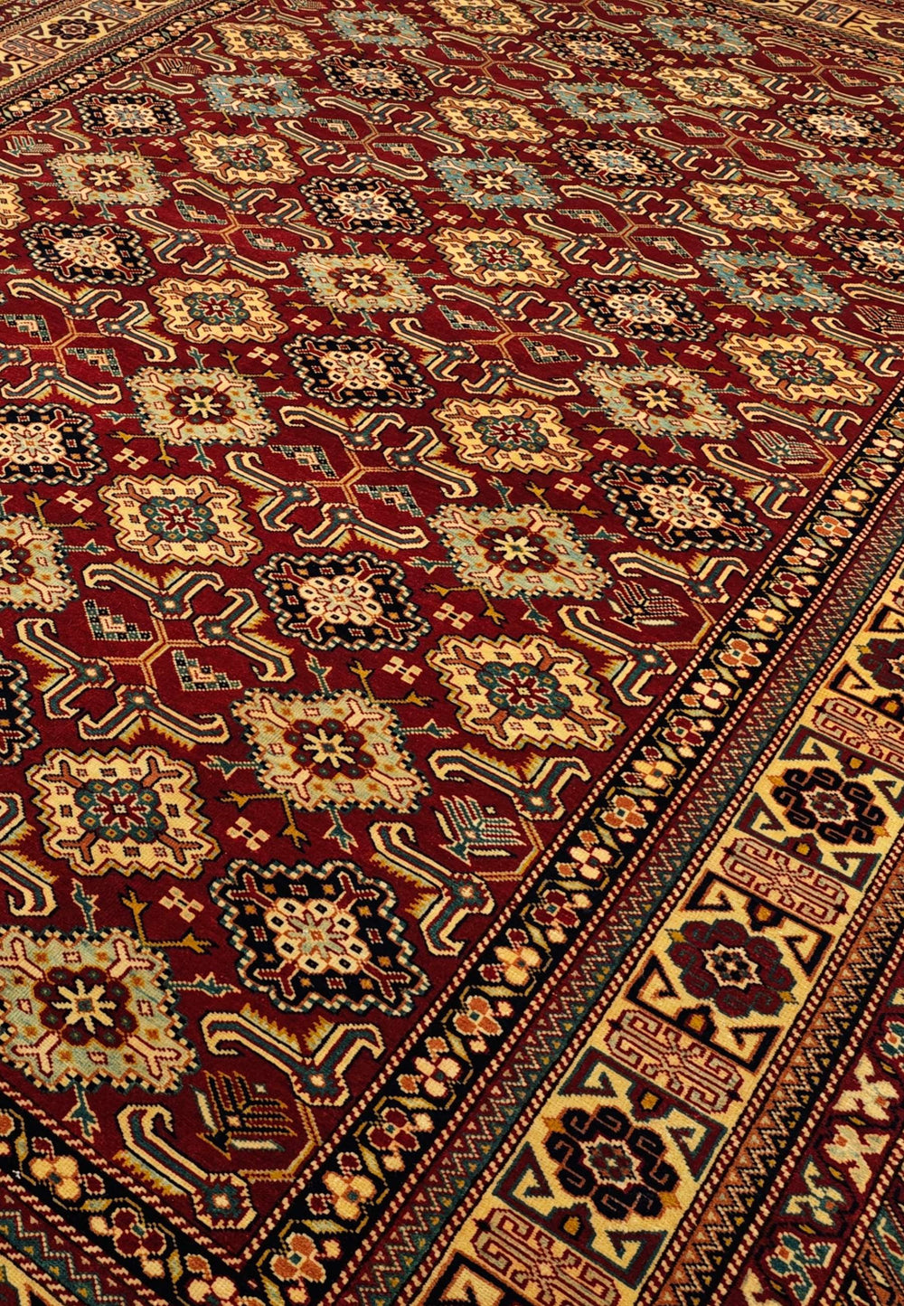 Shirvan gül lattice detail on red Afghan Sherwan wool rug