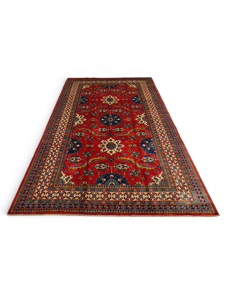 Border detail of red hand-knotted Afghan Sherwan rug