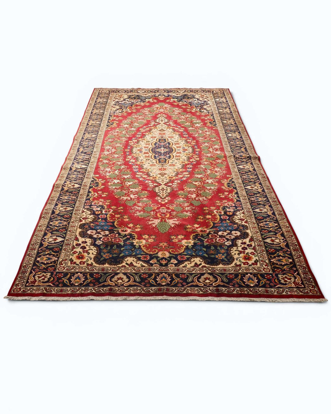 Floral medallion rug in red and navy, hand-knotted Afghan wool