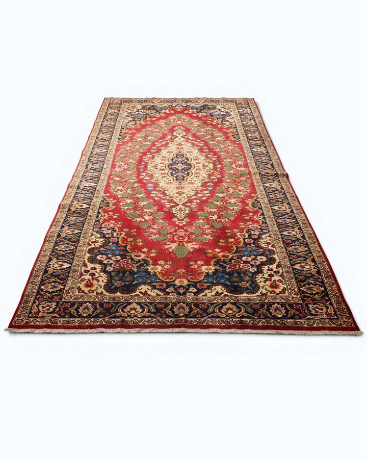 Floral medallion rug in red and navy, hand-knotted Afghan wool