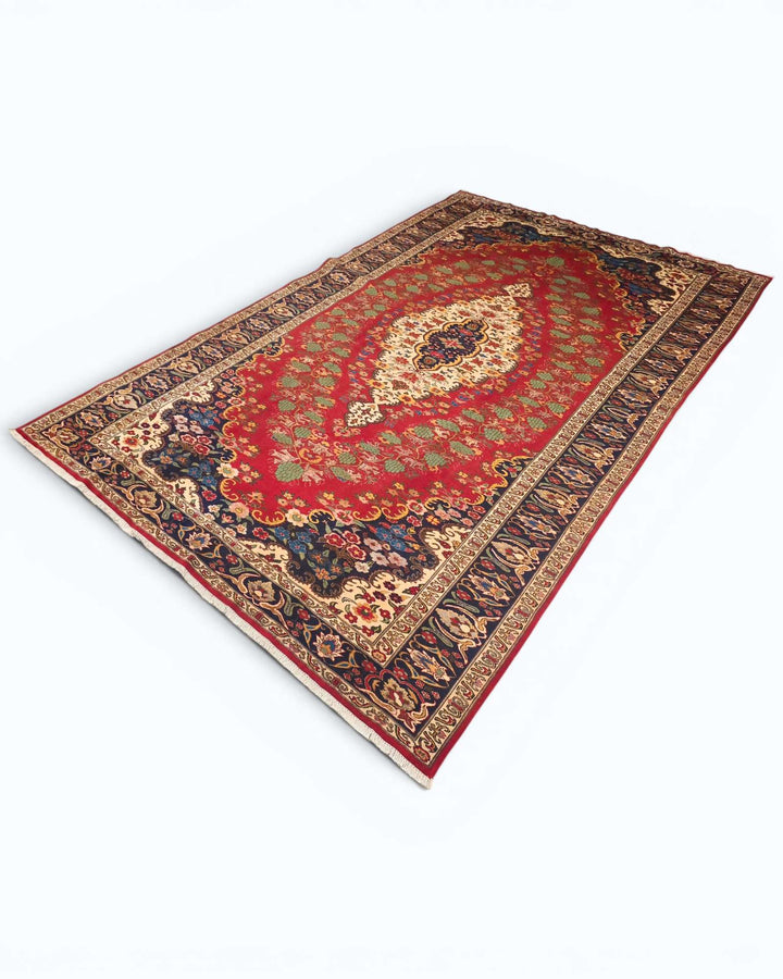Hand-knotted red Afghan rug with central floral medallion