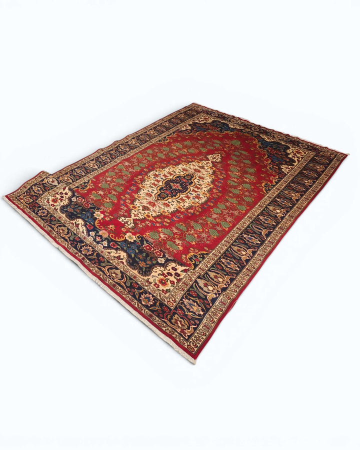 Fringe of red and navy floral medallion Afghan Sherwan rug