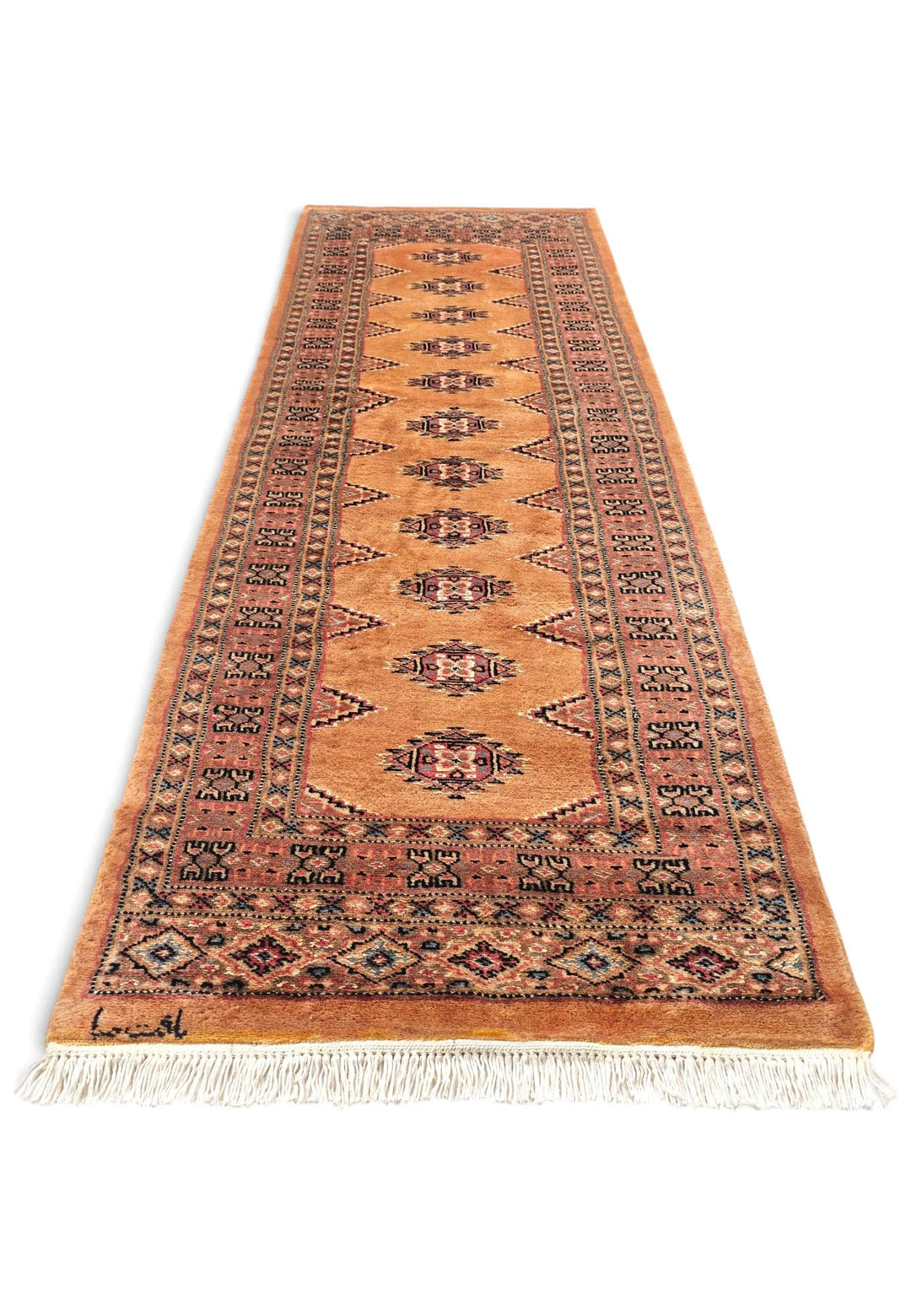 Border detail of apricot Yamoud hand-knotted rug