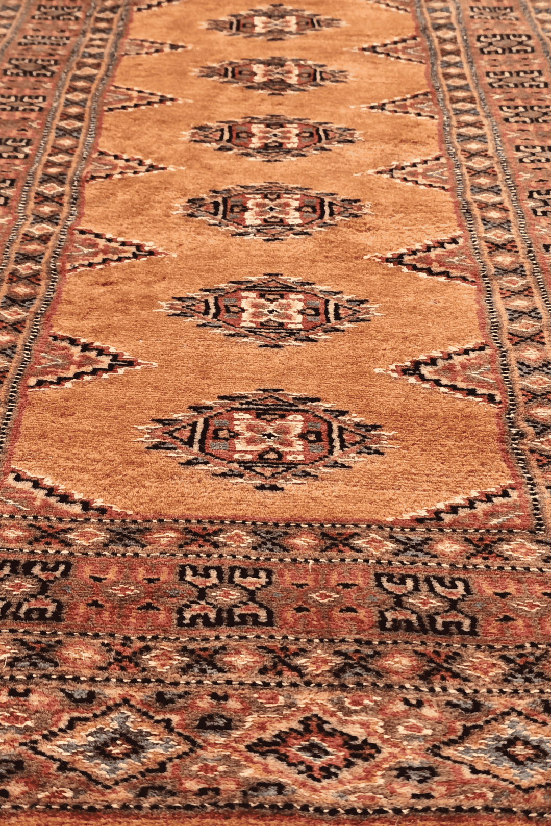 One-of-a-kind signed apricot and rose Yamoud rug
