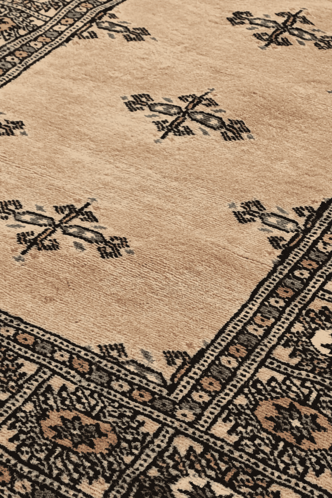 Open field detail in camel and espresso on Bokhara runner