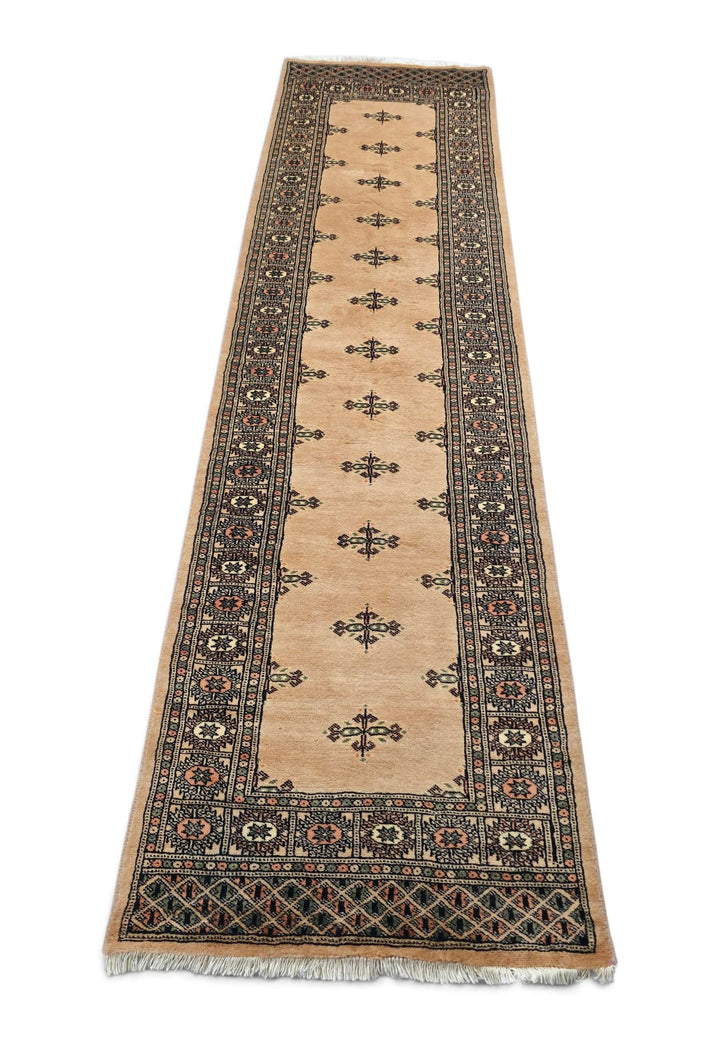 Border detail of camel Bokhara hand-knotted Pakistani runner