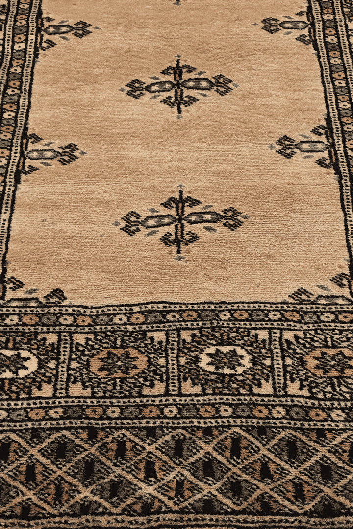 Hand-knotted camel Bokhara runner with plain open field