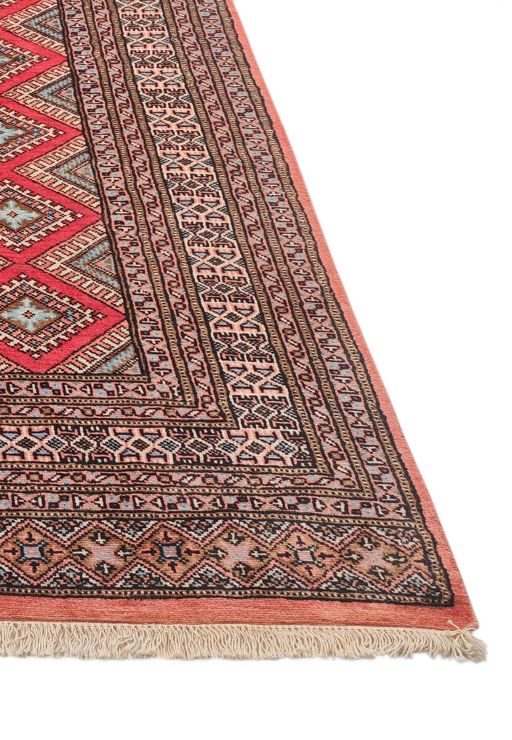 Hand-knotted crimson rug with salmon diamond lattice field