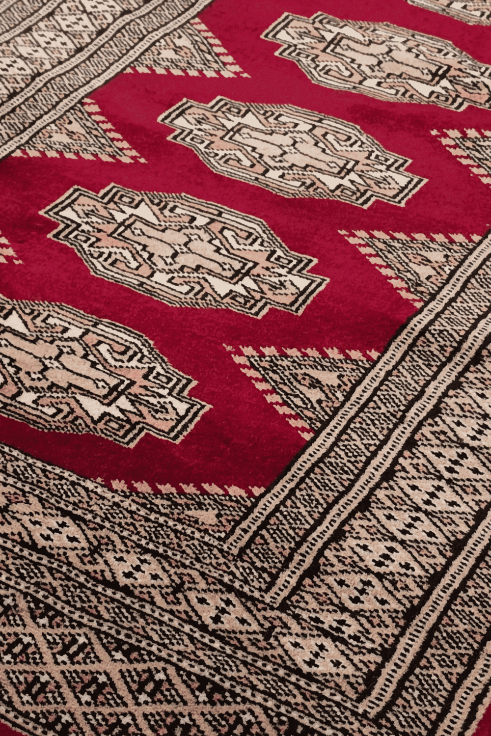 Turkmen Yamoud motifs in deep wine and beige on wool rug