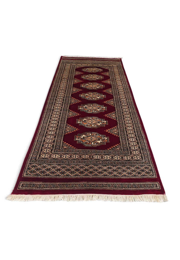 Border detail of deep wine and beige hand-knotted Yamoud rug