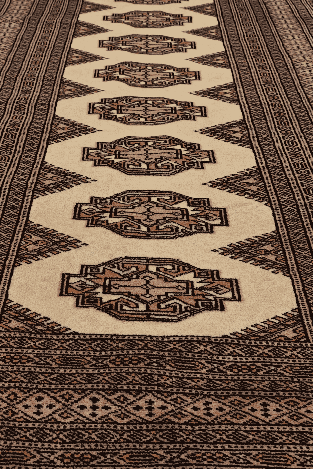 Hand-knotted beige Yamoud rug with brown Turkmen design