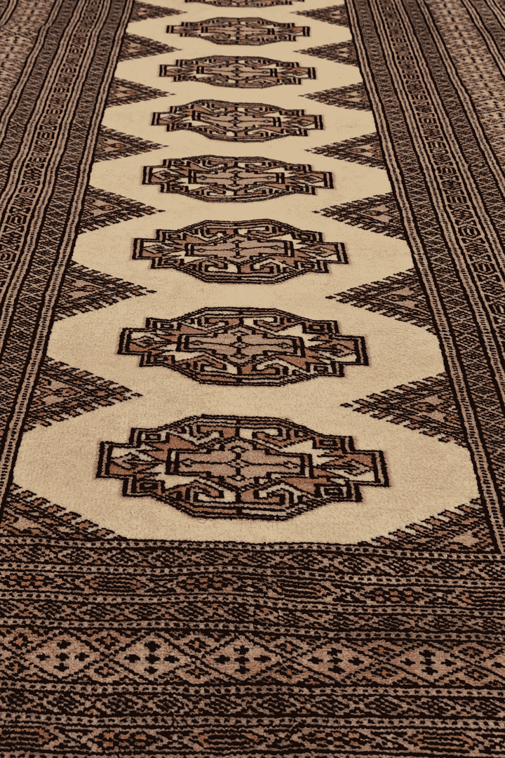 Hand-knotted beige Yamoud rug with brown Turkmen design