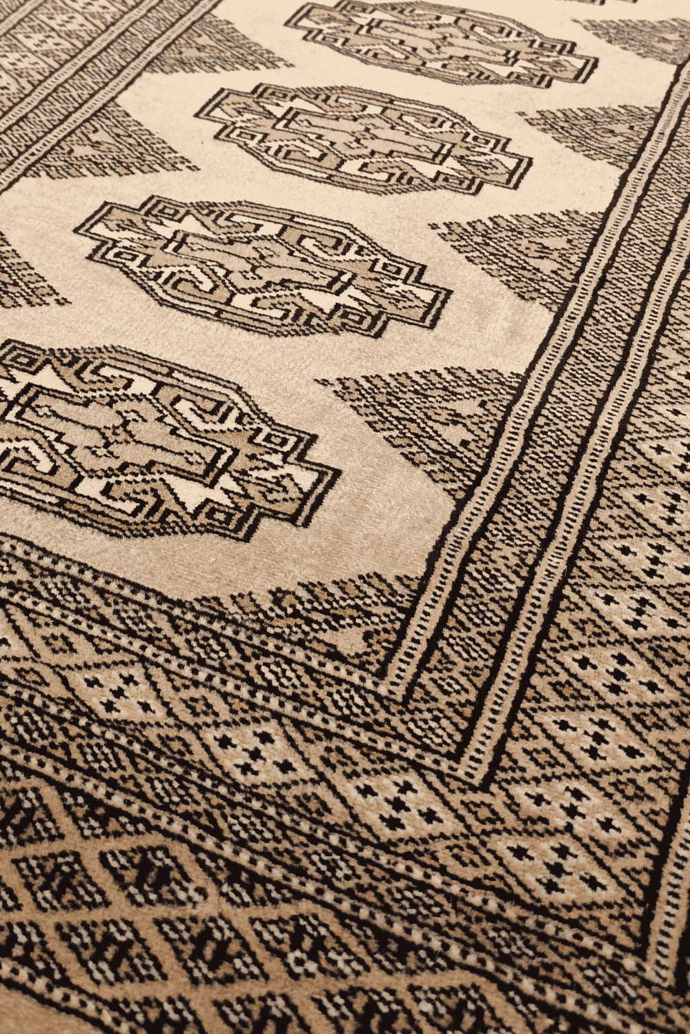 Turkmen Yamoud motifs in golden tan and beige on wool rug