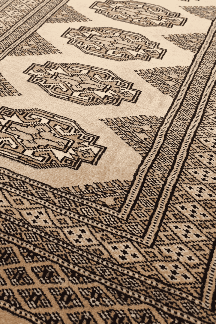 Turkmen Yamoud motifs in golden tan and beige on wool rug
