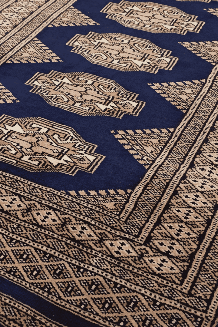 Turkmen Yamoud motifs in navy and beige on wool rug