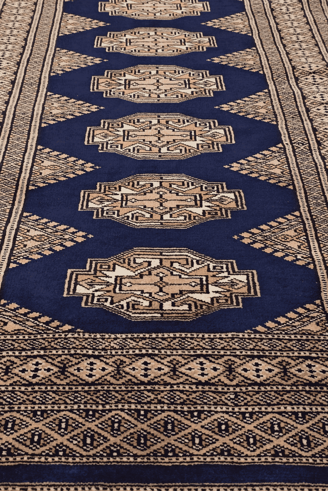 Hand-knotted navy Yamoud rug with Turkmen design