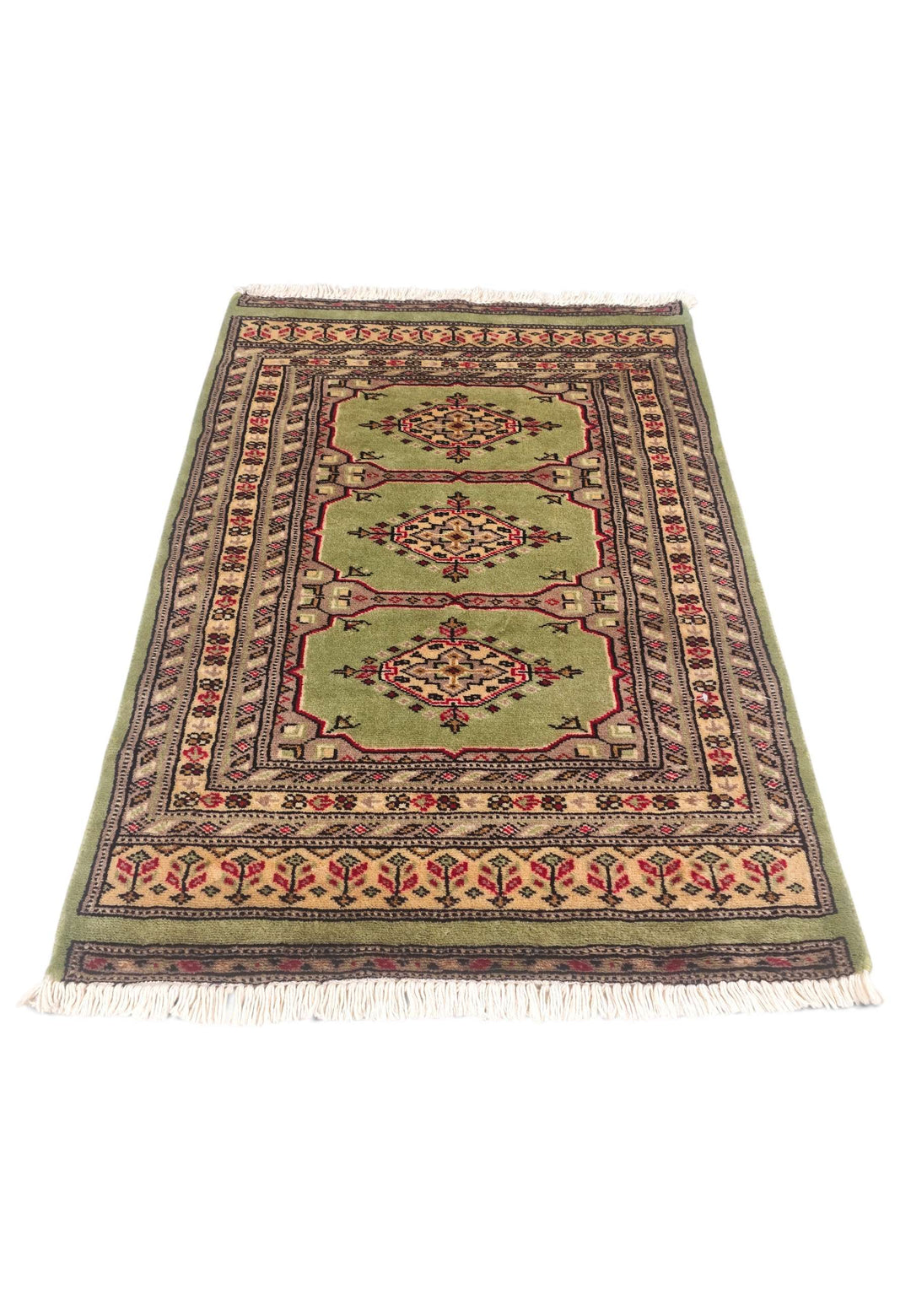 Border detail of olive green Kazak hand-knotted rug