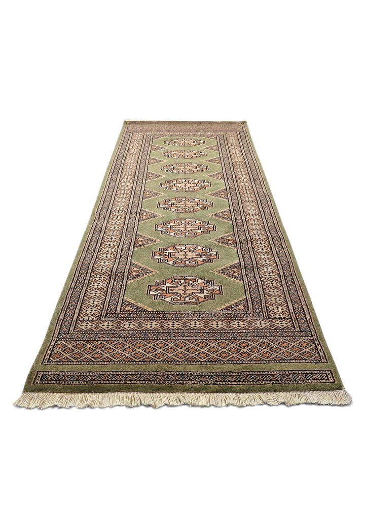 Border detail of olive green and beige hand-knotted Yamoud rug