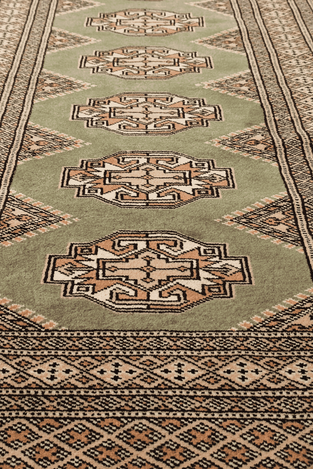 Hand-knotted olive green Yamoud rug with Turkmen design