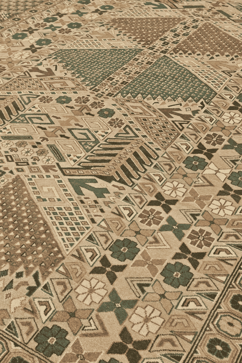 Turkmen gül detail in camel and green on Pakistani rug