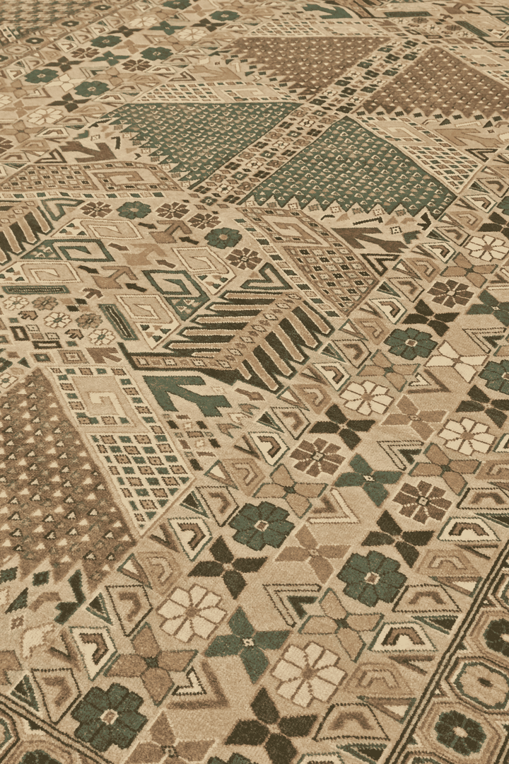 Turkmen gül detail in camel and green on Pakistani rug