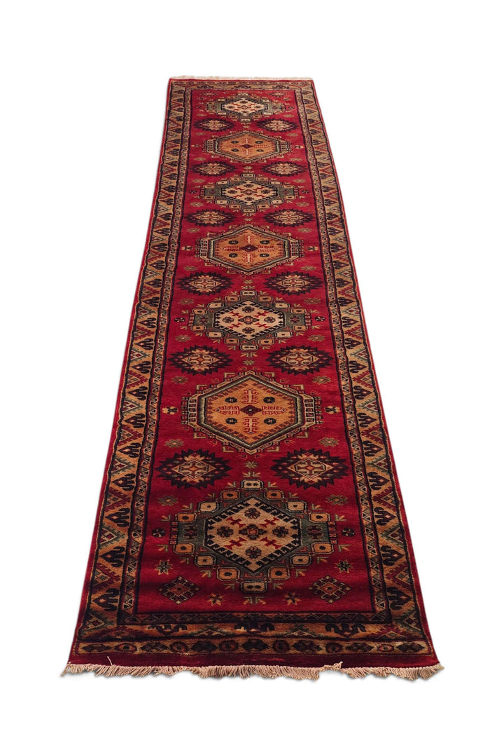 Border detail of red Kazak hand-knotted runner