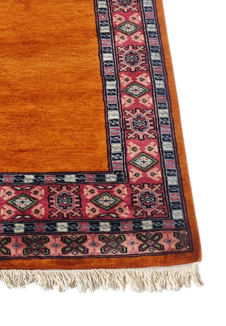 Corner of saffron and rose plain field hand-knotted runner