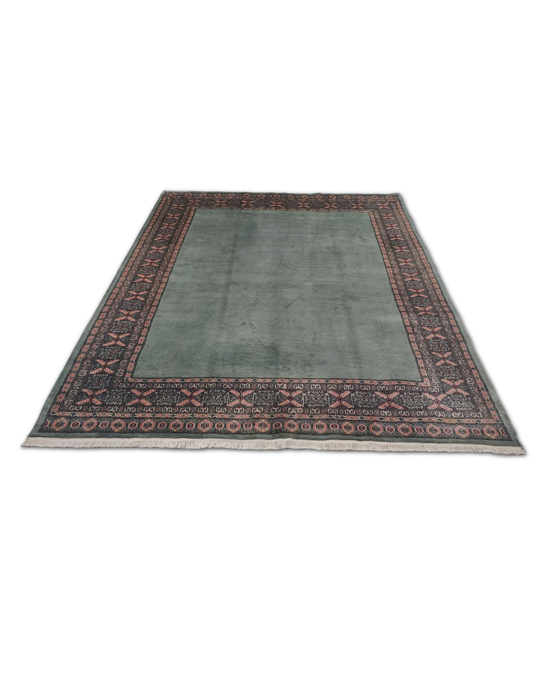 Border detail of sage green Bokhara hand-knotted Pakistani rug